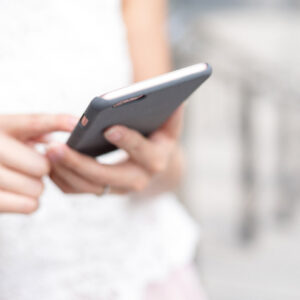woman holding cellphone